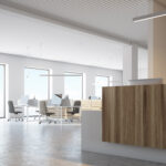 White wall office interior with a wooden reception table and an open space area. A side view. 3d rendering mock up